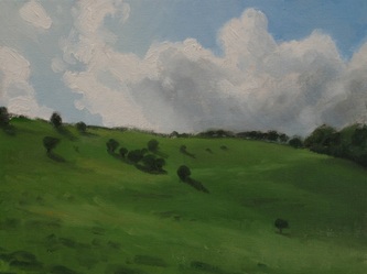 Realist oil painting of the downs near Amberley in West Sussuex. Big summer clouds rise above a steep grassy down, studded with scrubby trees and bushes.